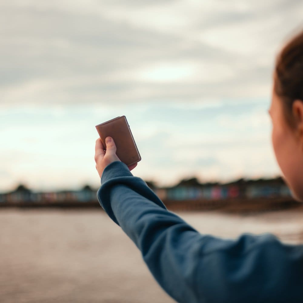 WalletAces - Our Story Main Image - Model With Enigma Wallet Classic Brown In Hand - Our Story Page